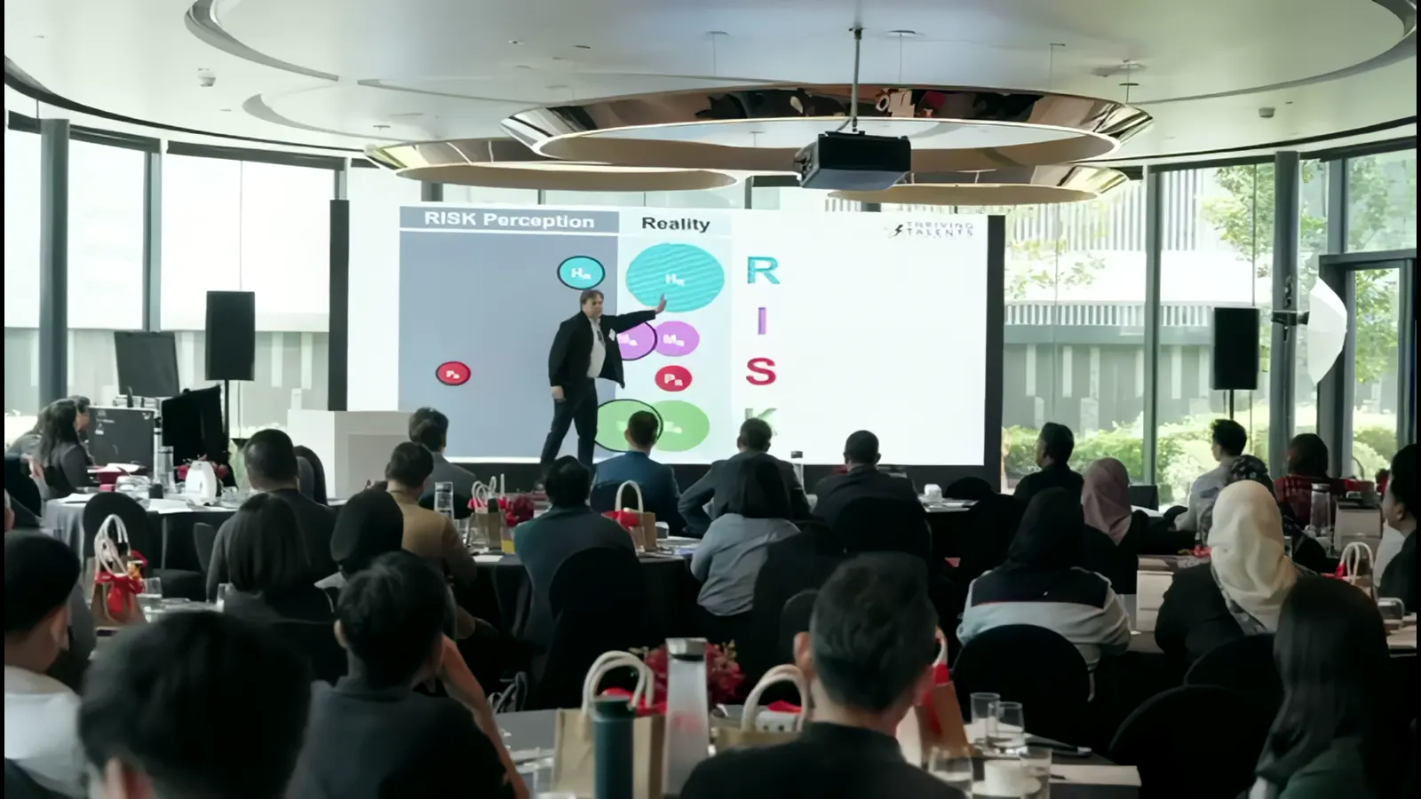 Peter on stage in front of a full conference room in Kuala Lumpur